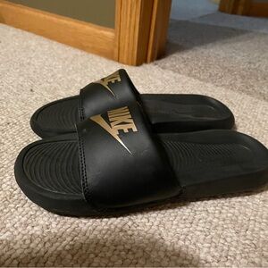 Nike Black and Gold Slides